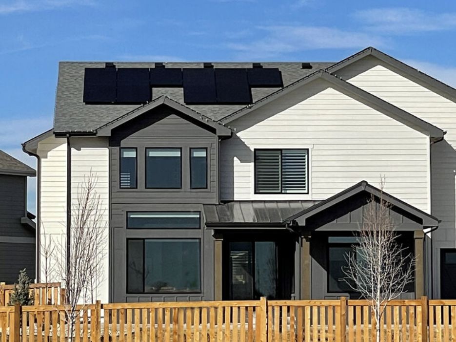 Upstate NY home with solar panels — IGS installs solar, heat pumps, geothermal, generators, roofing, and electrical